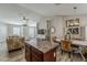 Open-concept living space with kitchen island, dining area, and comfortable living room at 1396 E Leslie Ave, San Tan Valley, AZ 85140