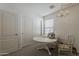 Bright office space with closet, sewing machine, and charming decor at 1396 E Leslie Ave, San Tan Valley, AZ 85140