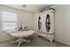 Bright home office features a white table and storage cabinet at 1396 E Leslie Ave, San Tan Valley, AZ 85140