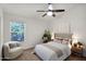 A bright bedroom with a comfy chair, neutral colors, and natural light creating a relaxing atmosphere at 1420 W Raven Dr, Chandler, AZ 85286