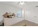 Bedroom with neutral colors, a ceiling fan and a window that brings in plenty of natural light at 1420 W Raven Dr, Chandler, AZ 85286