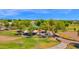 Aerial shot featuring green spaces and covered picnic areas in a Gathering-friendly community park at 1420 W Raven Dr, Chandler, AZ 85286