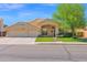 Charming single-Gathering home with a two-car garage and landscaped front yard at 1420 W Raven Dr, Chandler, AZ 85286