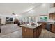Spacious kitchen flows into a living room with a fireplace at 1420 W Raven Dr, Chandler, AZ 85286