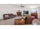 Living room features a brick fireplace, comfortable seating, and plenty of natural light at 1420 W Raven Dr, Chandler, AZ 85286