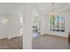 Spacious living space featuring archways, a classic chandelier, and ample natural light for a welcoming atmosphere at 1420 W Raven Dr, Chandler, AZ 85286