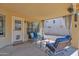 Inviting covered patio with comfortable seating and a view of the well-maintained backyard at 1420 W Raven Dr, Chandler, AZ 85286