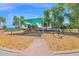 Community playground featuring a slide and climbing structures under a sun shade at 1420 W Raven Dr, Chandler, AZ 85286