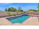 Inviting backyard pool with a spa, surrounded by lush landscaping for privacy and relaxation at 1420 W Raven Dr, Chandler, AZ 85286