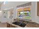 View from the kitchen sink of the outdoor pool and patio at 1420 W Raven Dr, Chandler, AZ 85286