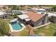 Aerial shot of backyard pool, outdoor kitchen, patio, and nicely landscaped property at 1670 E Whitten St, Chandler, AZ 85225