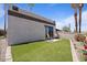 Private backyard with artificial turf, a patio, and comfortable seating area at 1670 E Whitten St, Chandler, AZ 85225