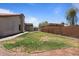 Spacious backyard with lush lawn and patio area, perfect for entertaining at 1670 E Whitten St, Chandler, AZ 85225