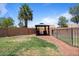 Beautiful landscaped backyard with a charming gazebo and sitting area, great for relaxing at 1670 E Whitten St, Chandler, AZ 85225