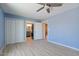 Bedroom boasts wood-look tile flooring, large closets, and views into an adjacent bathroom at 1670 E Whitten St, Chandler, AZ 85225