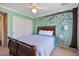 Charming bedroom with tree painted on the wall at 1670 E Whitten St, Chandler, AZ 85225