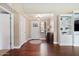 Inviting entryway featuring hardwood floors, neutral paint, and built-in shelves at 1670 E Whitten St, Chandler, AZ 85225