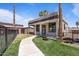 Charming exterior with landscaped yard, a cozy front porch, and appealing curb appeal at 1670 E Whitten St, Chandler, AZ 85225