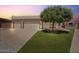 Charming home featuring a two-car garage and green lawn at 1670 E Whitten St, Chandler, AZ 85225