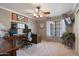 Comfortable home office featuring neutral walls, ceiling fan and large window with natural light at 1670 E Whitten St, Chandler, AZ 85225