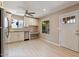 Bright, modern kitchen with white cabinets, stainless steel appliances, and wood-look tile flooring at 1670 E Whitten St, Chandler, AZ 85225
