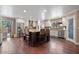The updated kitchen is equipped with stainless steel appliances, custom cabinets, and a granite island with bar seating at 1670 E Whitten St, Chandler, AZ 85225