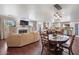 This spacious living room and kitchen includes a cozy fireplace and lots of natural light at 1670 E Whitten St, Chandler, AZ 85225