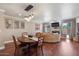 A bright and airy living room is adjacent to the kitchen and features nice lighting and furniture at 1670 E Whitten St, Chandler, AZ 85225