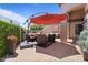 Inviting patio with comfortable seating and an umbrella for shade at 1670 E Whitten St, Chandler, AZ 85225