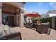 Inviting patio with comfortable seating and an umbrella for shade at 1670 E Whitten St, Chandler, AZ 85225