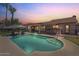 Inviting backyard featuring a refreshing pool, covered patio, and lush landscaping at 1670 E Whitten St, Chandler, AZ 85225