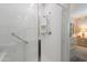Modern bathroom features a tiled shower with glass door, grab bar, and updated shower head at 17219 W La Luz Rd, Surprise, AZ 85387