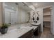 Bathroom featuring double sink vanity with white countertop and large mirror at 17219 W La Luz Rd, Surprise, AZ 85387
