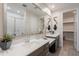 Elegant bathroom featuring double sinks, a large mirror, and modern fixtures, offering a luxurious and functional space at 17219 W La Luz Rd, Surprise, AZ 85387