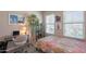 Cozy bedroom with a dedicated workspace and ample natural light from the windows at 17219 W La Luz Rd, Surprise, AZ 85387