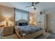 Bright bedroom with a ceiling fan, wardrobe, and stylish furniture at 17219 W La Luz Rd, Surprise, AZ 85387