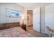Comfortable bedroom featuring a wood bed frame, colorful bedding, and tasteful wall art creating a relaxing atmosphere at 17219 W La Luz Rd, Surprise, AZ 85387