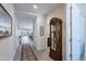 Spacious hallway with modern decor, neutral walls, and views into multiple rooms at 17219 W La Luz Rd, Surprise, AZ 85387