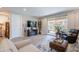 Comfortable living room featuring cozy seating and direct access to the outdoor patio at 17219 W La Luz Rd, Surprise, AZ 85387