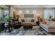 Comfortable living room with stylish seating, area rug, and plenty of natural light at 17219 W La Luz Rd, Surprise, AZ 85387