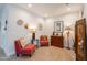Charming living room featuring accent chairs, unique decor and neutral wall tones that create a relaxing and inviting atmosphere at 17219 W La Luz Rd, Surprise, AZ 85387