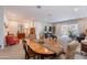 Open-concept living room and dining area with lots of natural light and neutral color palette at 17219 W La Luz Rd, Surprise, AZ 85387