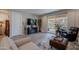 Cozy living room has a modern fireplace and sliding glass doors that lead to the outdoor patio at 17219 W La Luz Rd, Surprise, AZ 85387