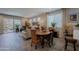 Open-concept living and dining area featuring stylish furnishings and sliding glass doors to the patio at 17219 W La Luz Rd, Surprise, AZ 85387