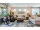 Bright and spacious living room with comfortable seating, a large window, and stylish decor, creating a welcoming atmosphere at 17219 W La Luz Rd, Surprise, AZ 85387