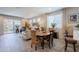 Spacious living room flows into the dining area and kitchen, offering an open and airy layout for easy entertaining and everyday living at 17219 W La Luz Rd, Surprise, AZ 85387