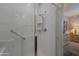 Modern tiled shower with glass door and convenient grab bar at 17219 W La Luz Rd, Surprise, AZ 85387