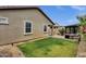 Backyard with a small grassy area, hardscape, and a grill at 1725 E Chanute Pass --, Phoenix, AZ 85040