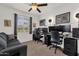 Comfortable bedroom with ample desk space, ceiling fan, and natural light from the window at 1725 E Chanute Pass --, Phoenix, AZ 85040