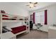 ' bedroom with bunk beds, study desk, and window for natural light at 1725 E Chanute Pass --, Phoenix, AZ 85040
